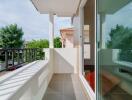 Small balcony with glass door and outdoor views