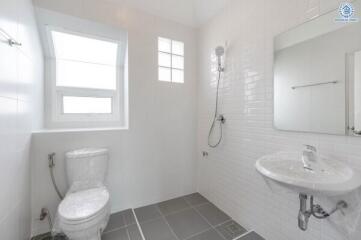 Modern bathroom with white walls and fixtures