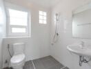 Modern bathroom with white walls and fixtures