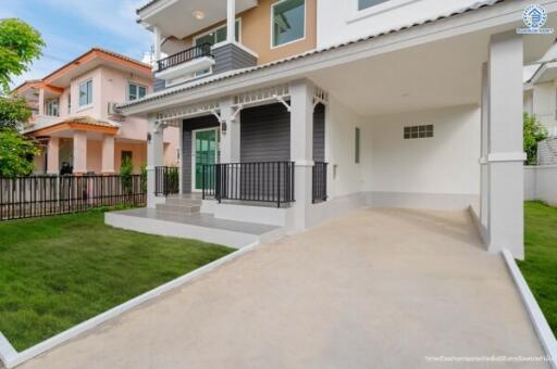 Front view of a modern two-story house with a driveway