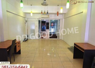 Main living area with tiled floor and hanging lights