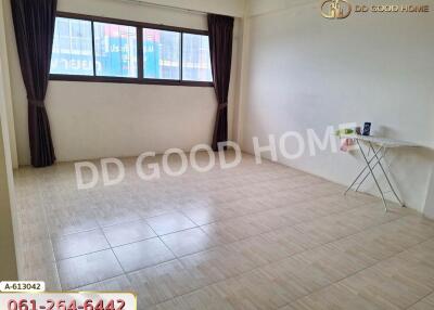 Empty room with tiled flooring and window