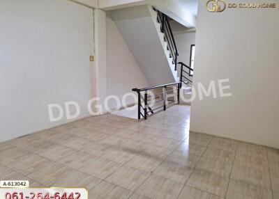 Empty room with tiled flooring and staircase