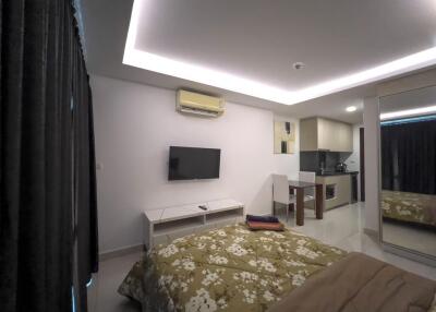 Modern bedroom with integrated kitchenette and air conditioning