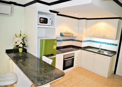 Modern kitchen with appliances and breakfast bar