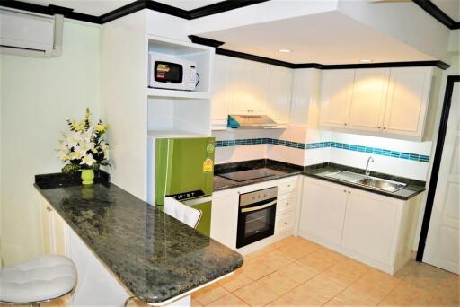 Modern kitchen with appliances and breakfast bar