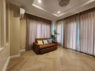 Living room with sofa and large windows