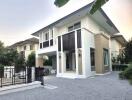 Modern two-story house with a carport