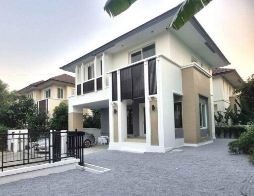 Modern two-story house with a carport