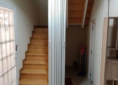 Entryway with staircase and closet