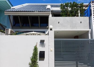 Two-story modern house with gray and white exterior