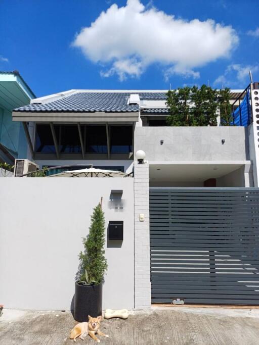 Two-story modern house with gray and white exterior