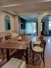 Dining area with wooden table and chairs