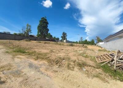 Vacant plot of land with clear blue sky