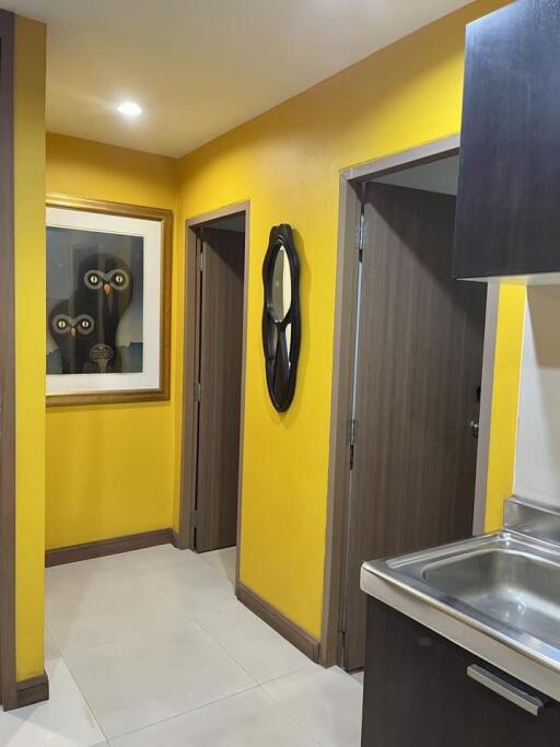 Hallway with yellow walls and modern decor