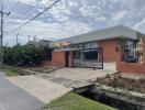 Modern single-story building with flags