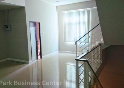 Main living area with stairs and window