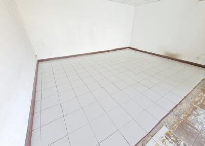 Spacious empty room with tiled flooring