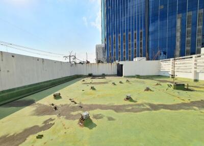 Rooftop area of the property with views of adjacent buildings