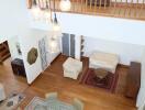 Main living space with view from above, featuring dining and seating areas