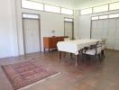 Spacious dining area with large windows and natural light