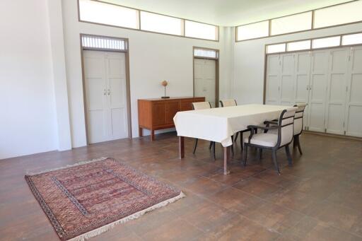 Spacious dining area with large windows and natural light