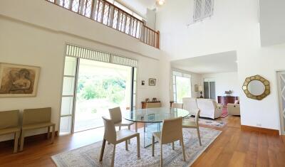 Spacious and bright living and dining area with high ceiling