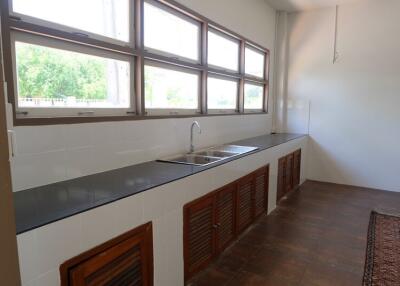 Modern kitchen with large windows and ample counter space