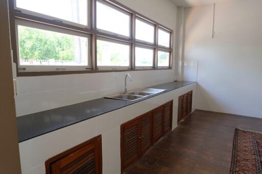 Modern kitchen with large windows and ample counter space