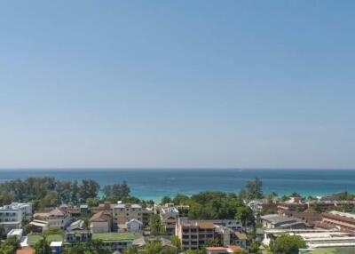 Scenic view of a seaside town with ocean in the background