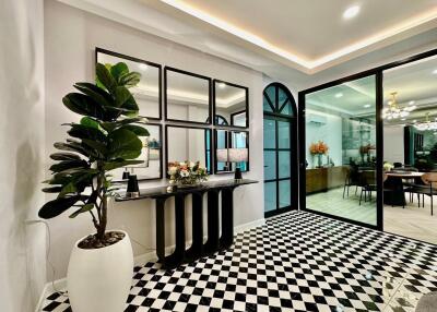 Modern living space with checkerboard flooring and large windows