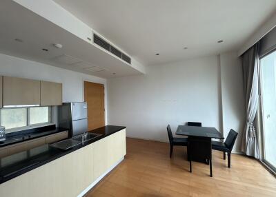 modern kitchen and dining area with black furniture