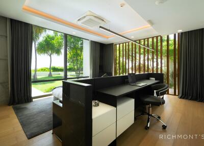 Modern bedroom with desk and garden view