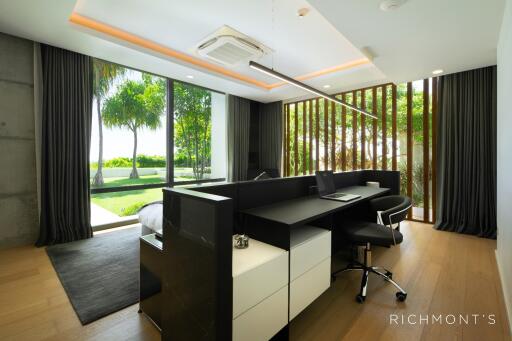 Modern bedroom with desk and garden view