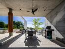 Modern outdoor patio with dining set and barbecue grill