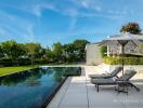 Luxury outdoor space with pool and sun loungers