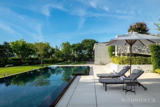 Luxury outdoor space with pool and sun loungers