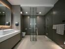 Modern bathroom with glass shower and double sink