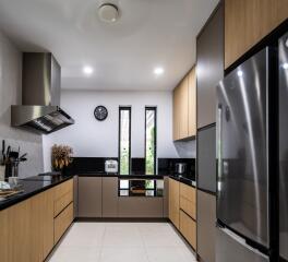 Modern kitchen with stainless steel appliances and wooden cabinetry