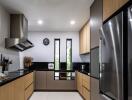 Modern kitchen with stainless steel appliances and wooden cabinetry