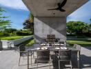 Modern outdoor dining area with table, chairs, and ceiling fan