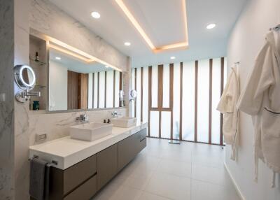 Modern bathroom with double sink vanity and large mirror