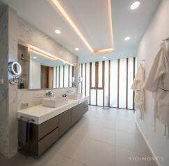 Modern bathroom with double sink vanity and large mirror