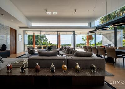 Spacious living room with modern furniture and a scenic outdoor view