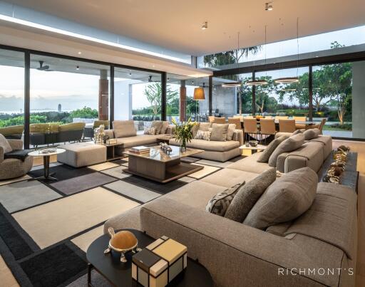 Spacious modern living room with large windows and elegant furniture