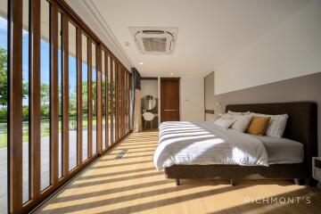 Spacious bedroom with large windows