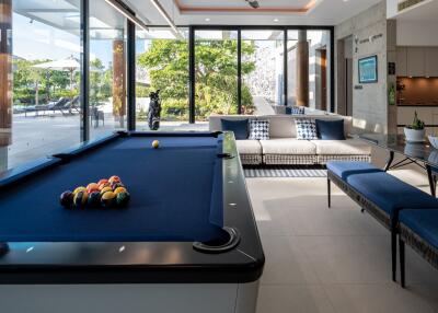 main living area with a pool table and seating