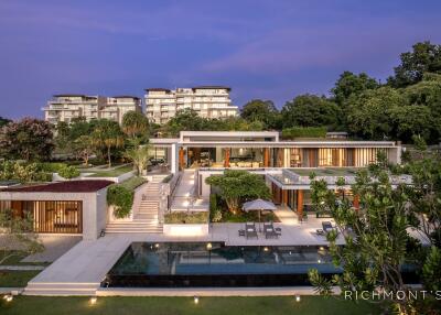 Luxury residential property with modern architecture and pool at dusk