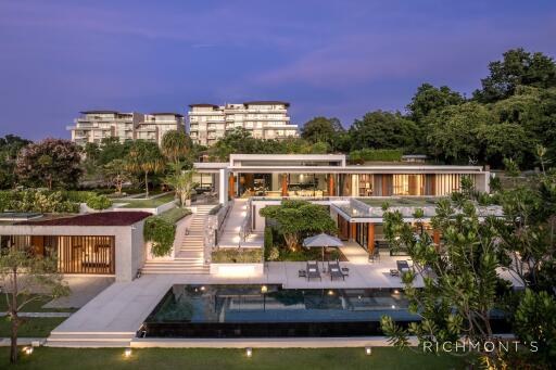 Luxury residential property with modern architecture and pool at dusk