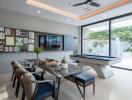 Recreational room with dining area, pool table, and large windows